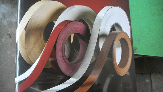 Coils of coloured edge-banding material