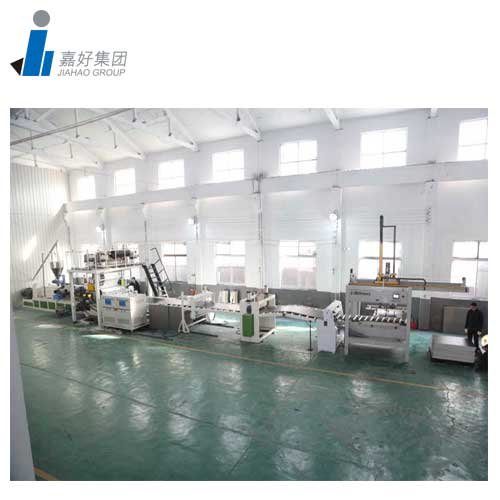 Extrusion machinery arranged inside a factory workshop